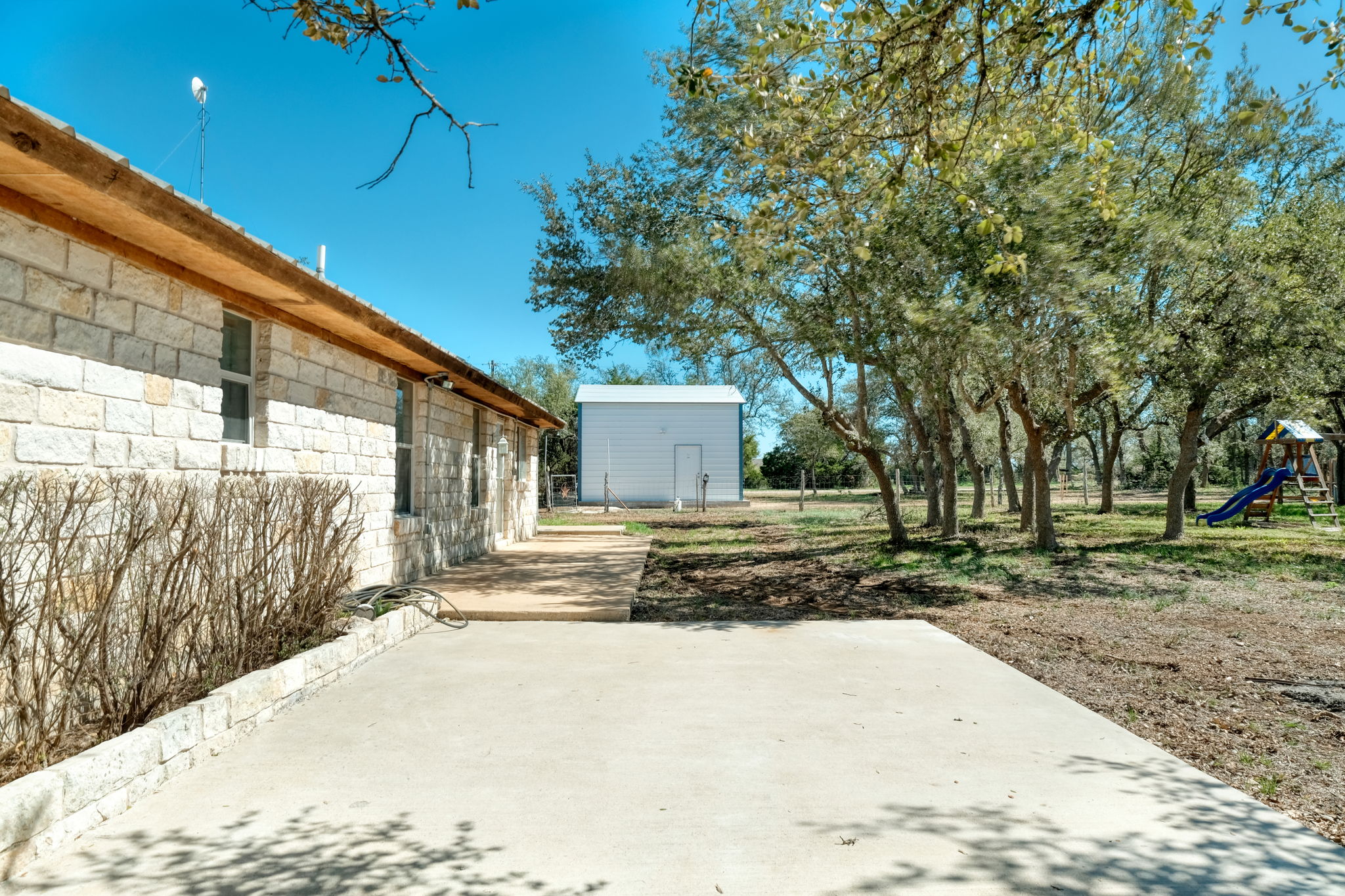 Back of House/Storage Shed and Patio