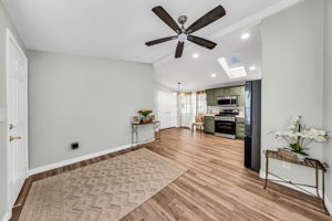 Open floorplan, ceiling fan, fresh paint, high ceilings