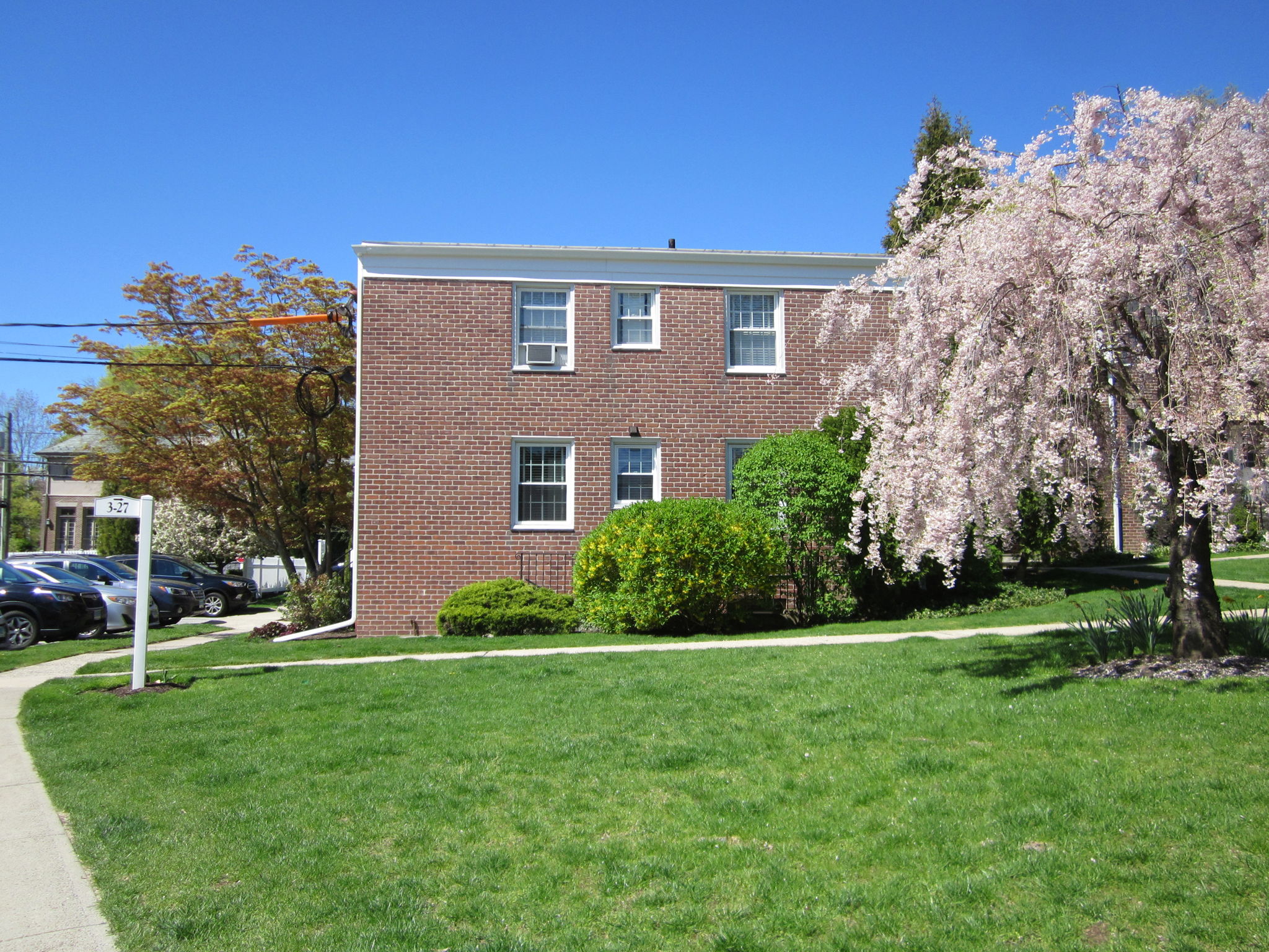 East-facing facade. 2 corner Bedrooms overlook courtyard entryway