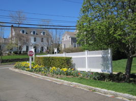 Putnam Park entry drive opposite two elegant period Colonials