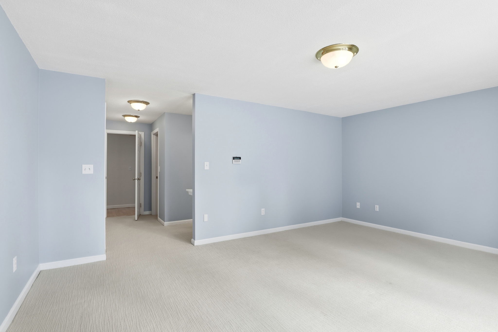 Primary Bedroom Suite II | With custom shelving in double closets & walk-in closet