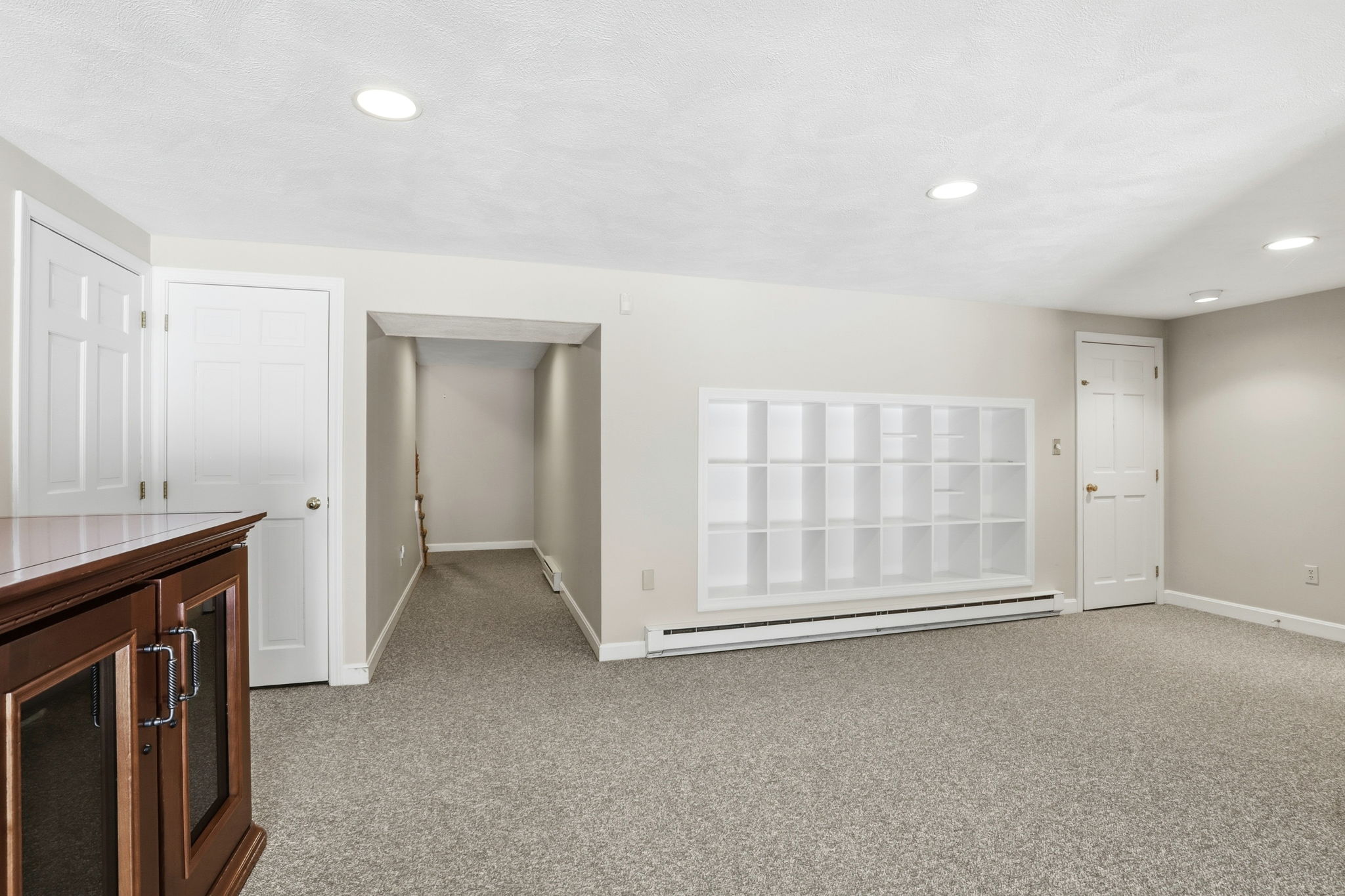 Family Room, Lower Level II | With wine storage and custom shelving