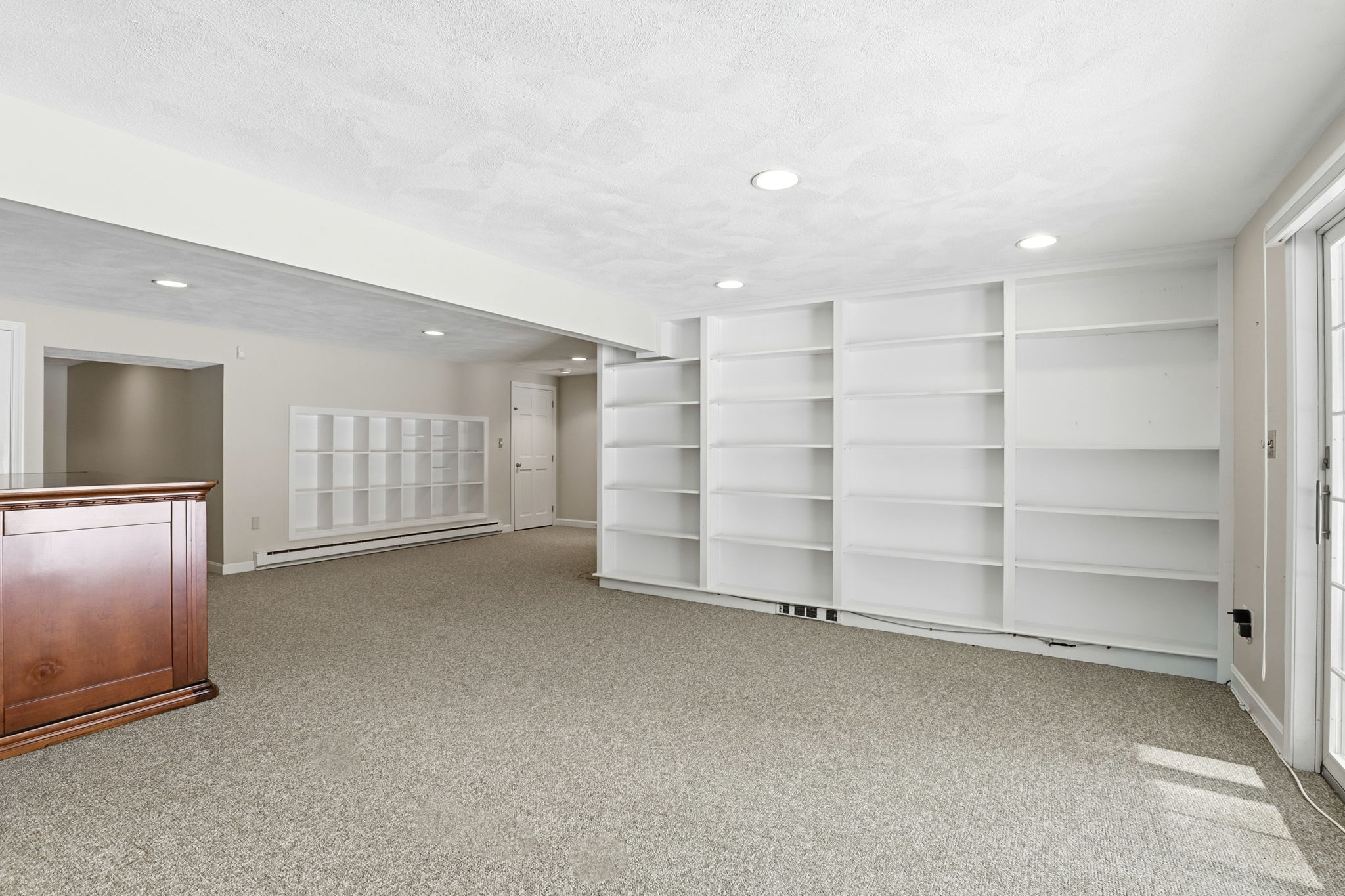 Family Room, Lower Level III | With wine storage and custom shelving