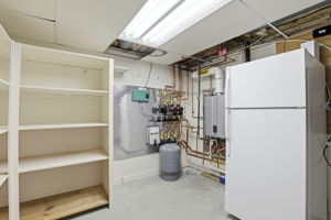 Utility Room | With fridge, storage and on-demand hot water heater