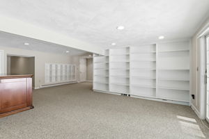 Family Room, Lower Level III | With wine storage and custom shelving