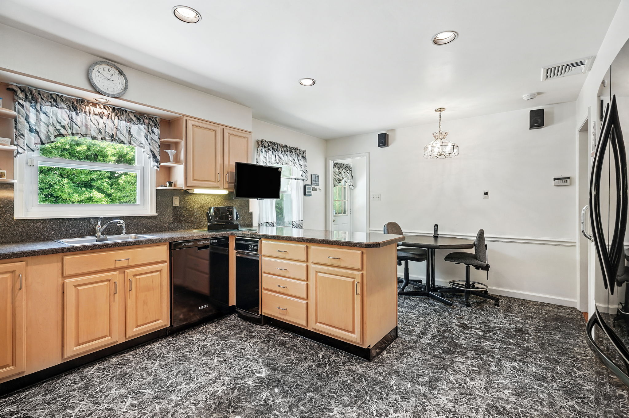 Eat in Kitchen remodeled in 1991; door to rear patio