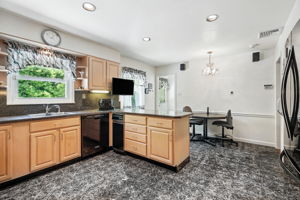 Eat in Kitchen remodeled in 1991; door to rear patio
