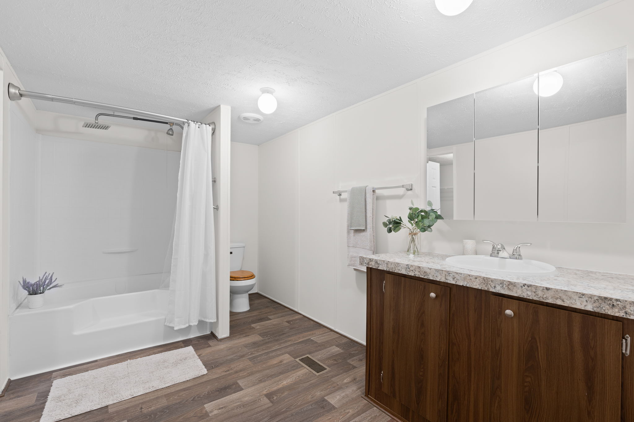 Functional and clean master bathroom—simple design with all the essentials for your daily routine.