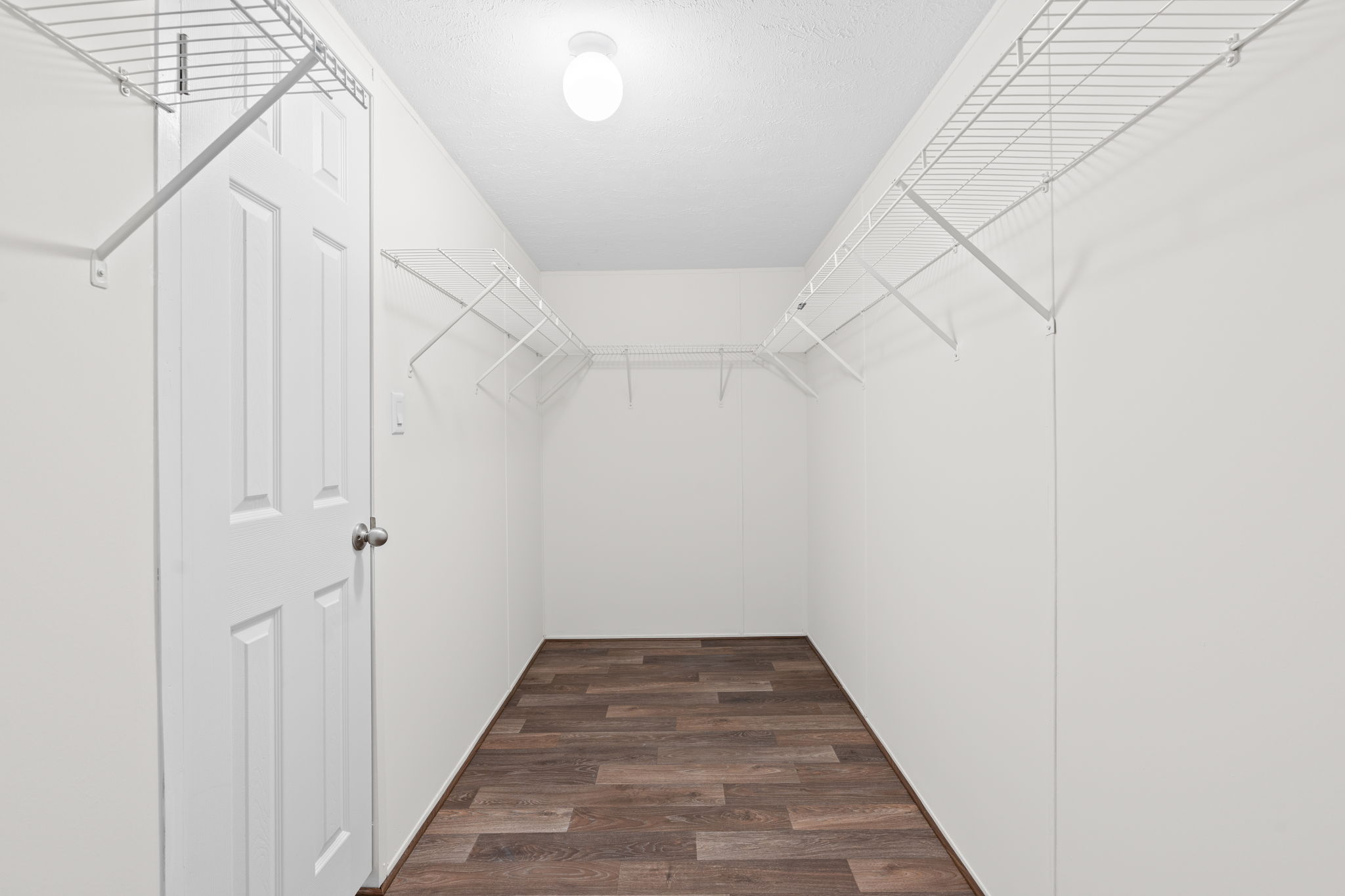 Generous master closet with plenty of space to organize your wardrobe and essentials.