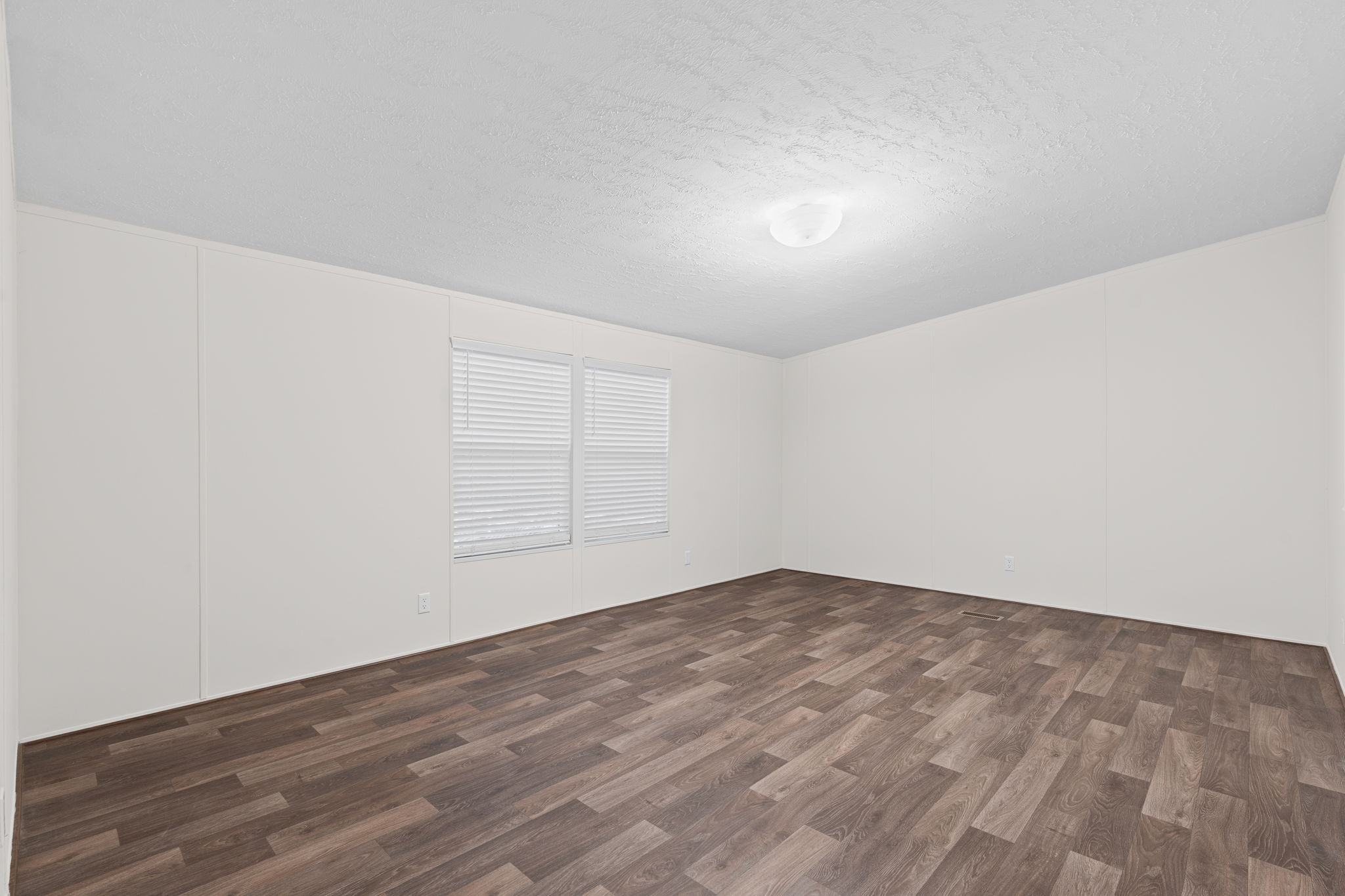 Spacious master bedroom offering a peaceful retreat with plenty of room to relax and unwind.