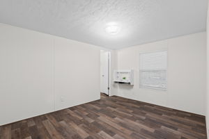 Comfortable and straightforward—this bedroom offers just the right amount of space and a built-in closet for easy storage.