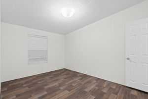 Comfortable second bedroom with a spacious closet for all your storage needs.