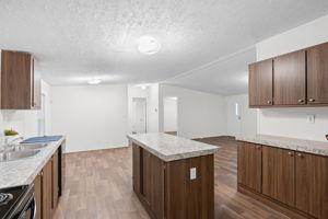 Kitchen opens up to a cozy breakfast nook—perfect for morning coffee or casual meals with a view of the yard.