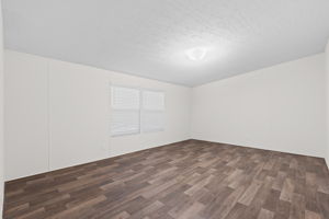 Spacious master bedroom offering a peaceful retreat with plenty of room to relax and unwind.
