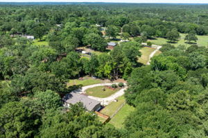 Rear of the home facing left, overlooking a peaceful, spacious backyard perfect for relaxing or entertaining.
