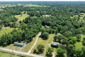 Front of the home facing left, perfectly positioned on a spacious, beautifully fenced lot.