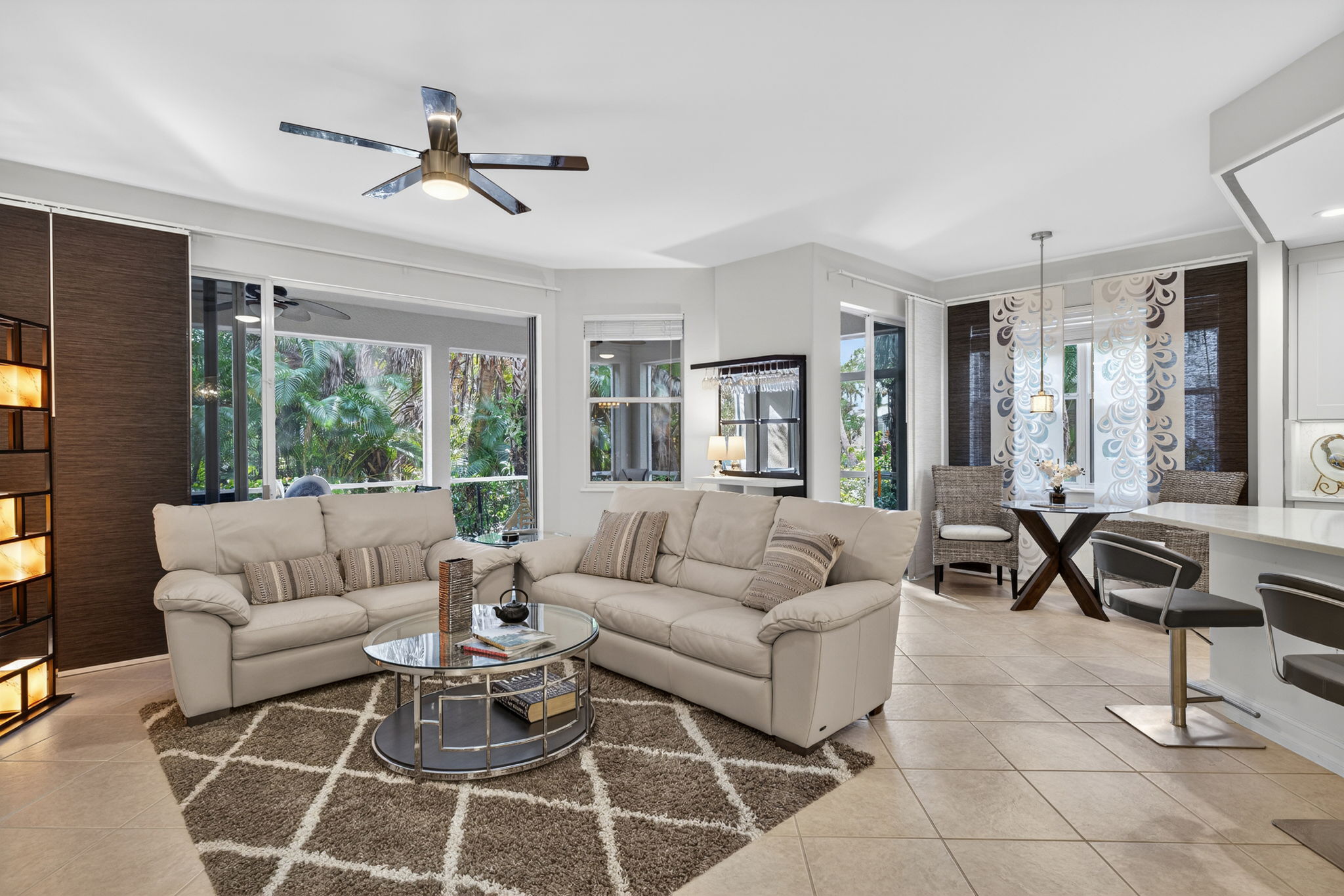 Sliders open to lanai for breezes, to entertain