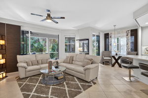 Sliders open to lanai for breezes, to entertain