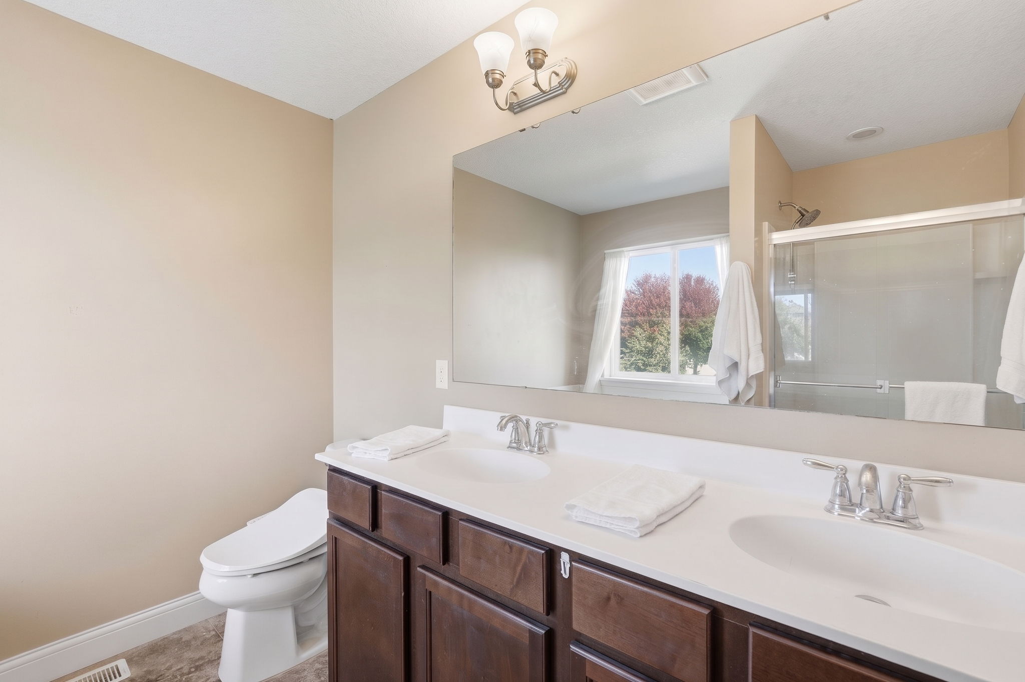 20024 Fern Glen Lane N - Primary bathroom with double sinks, separate tub and shower