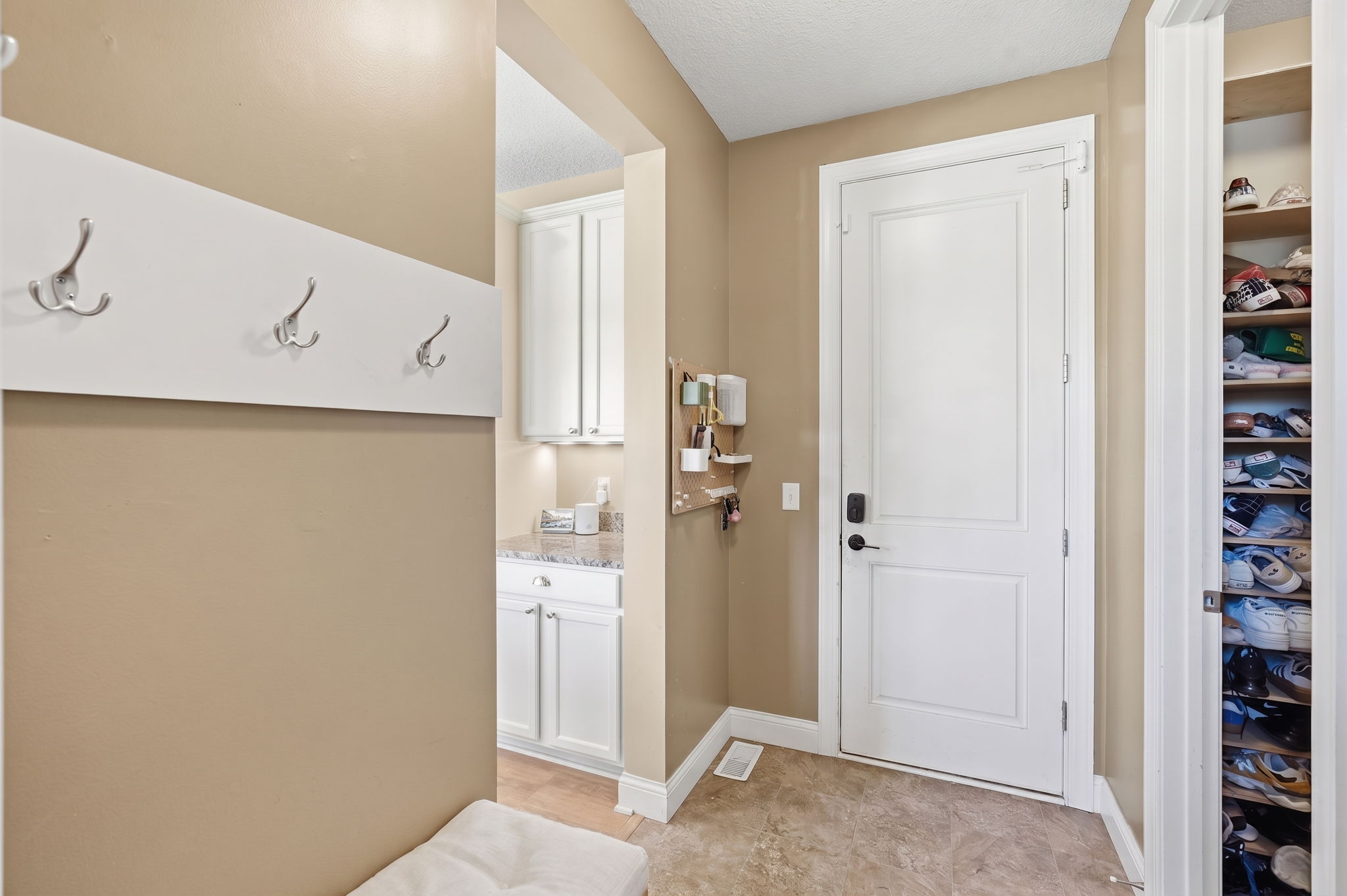 20024 Fern Glen Lane N - Mudroom area off the garage with built-in bench seating