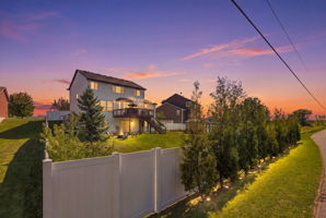 20024 Fern Glen Lane N - Evening view - great landscaping lighting
