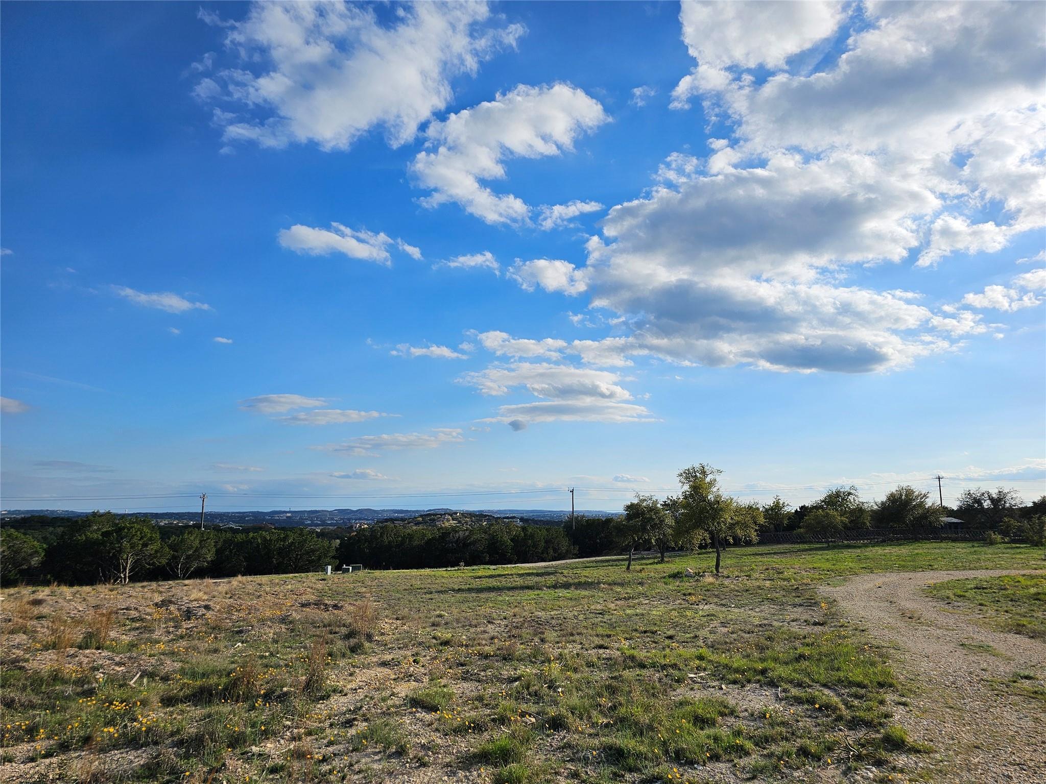 Backside View of Property towards Lakeway.  To the right is the garden and to the left is the entrance gate.