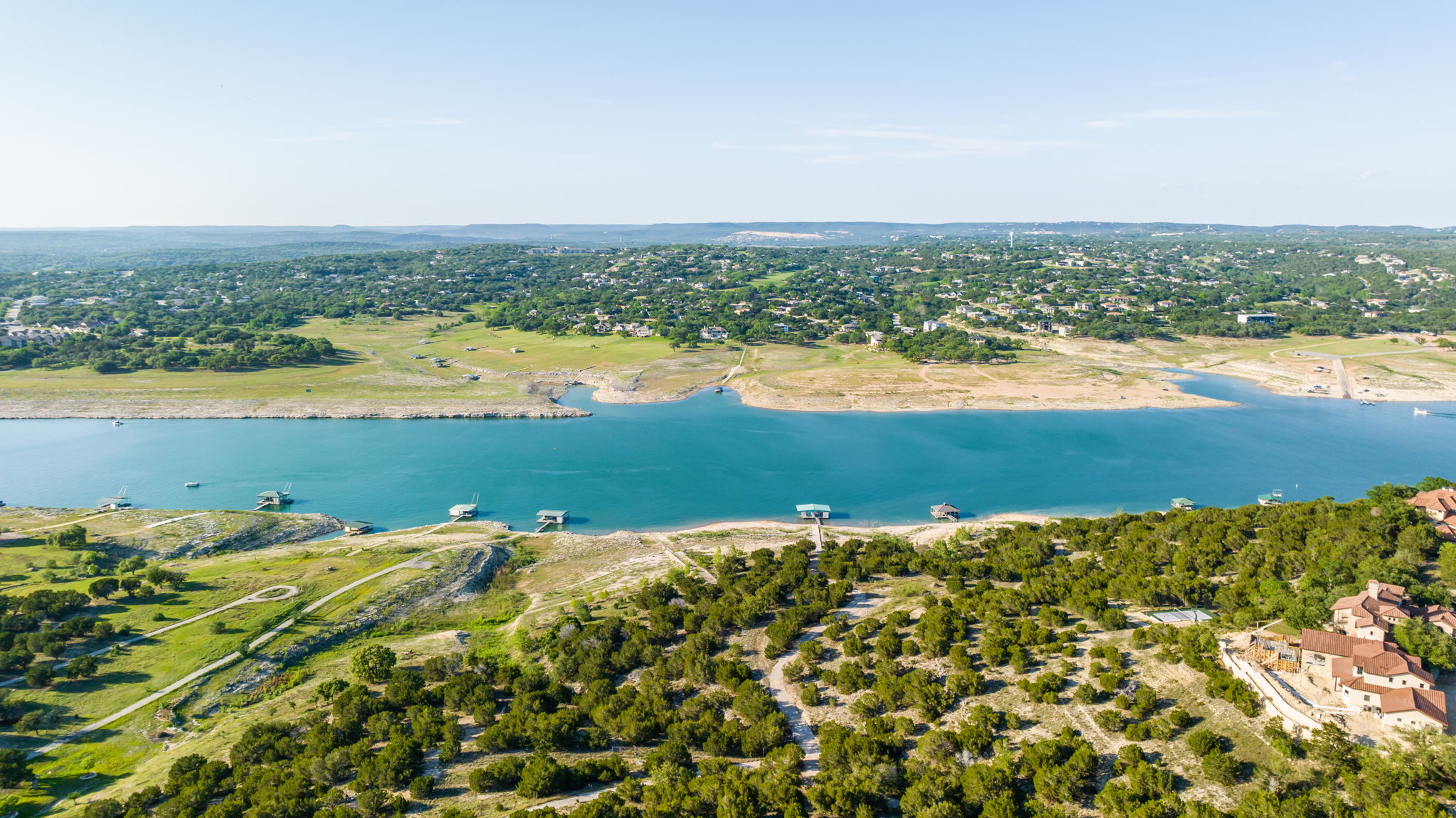 Great setting on the South Shore of Lake Travis with open and deep water. Even with the current water levels, boat docks are in good water. Boat is not included.