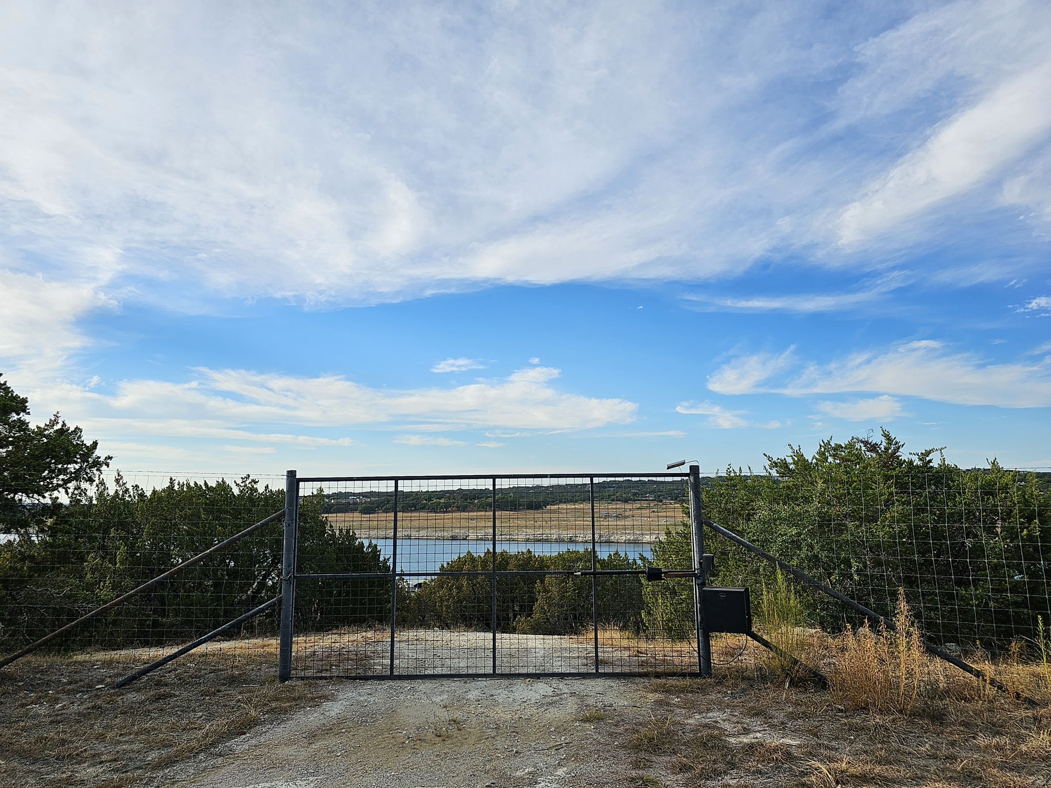 High Game Fence surrounds the Majority of the Property. This is the gate that leads down to the boat dock. This is out of the flood plain.