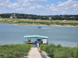 Easy Access to Your Private Boat Dock. The boat dock has 2 slips, jet ski cable lift, 1 swim ladder and storage. The top of the rail system is at about 700 ft elevation. The boat is not included. System allows boat dock to move with various water levels. Photo taken in June.