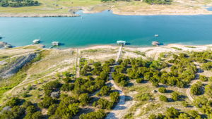 Your Boat Dock is the second one from the right. Aerial View of Waterfront on South Shore of Lake Travis. Boat dock is in good water even with current levels. Boat dock has rail system. A second water access point has a floating boat dock infrastructure. This is the deep side of Lake Travis.