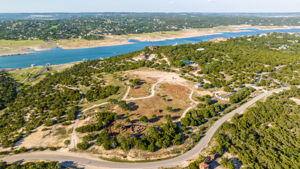Property is located on South Shore of Lake Travis between Briarcliff and the Reserve. Land was partially cleared on the hilltop for a homesite. Road access slopes down to the waterfront and your private dock.