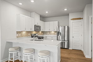 Backsplash, under cabinet lighting and pantry.