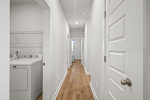 Hallway leading to bedroom 2 and 3, plus full bath.