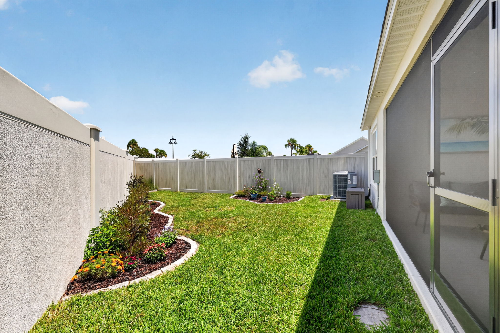 SPACIOUS Rear Yard with PRIVACY Wall and Fencing