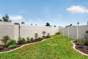 SPACIOUS Rear Yard with PRIVACY Wall and Fencing
