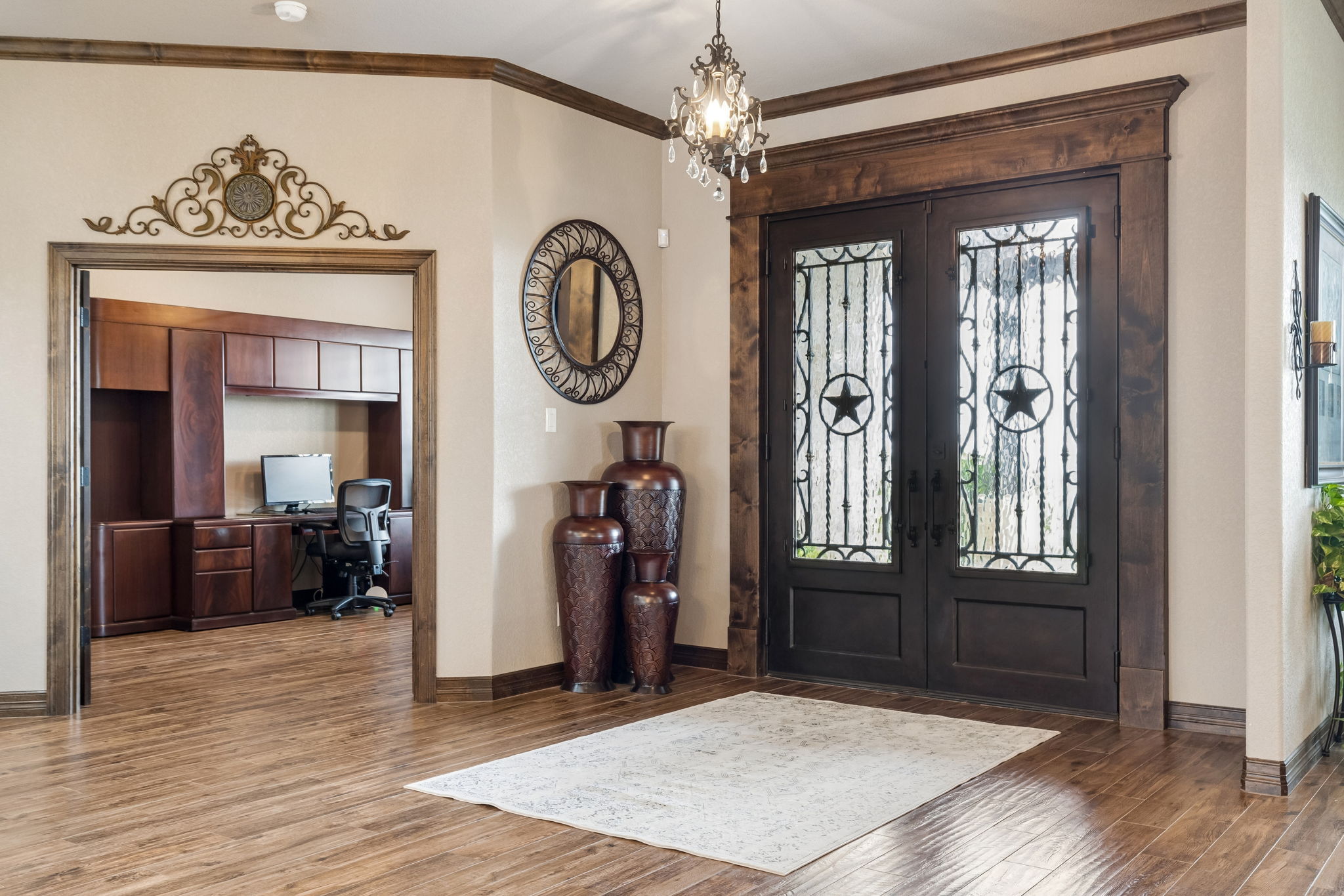 Magnificent double iron doors in the foyer and fresh doors (folded back) lead not the office.