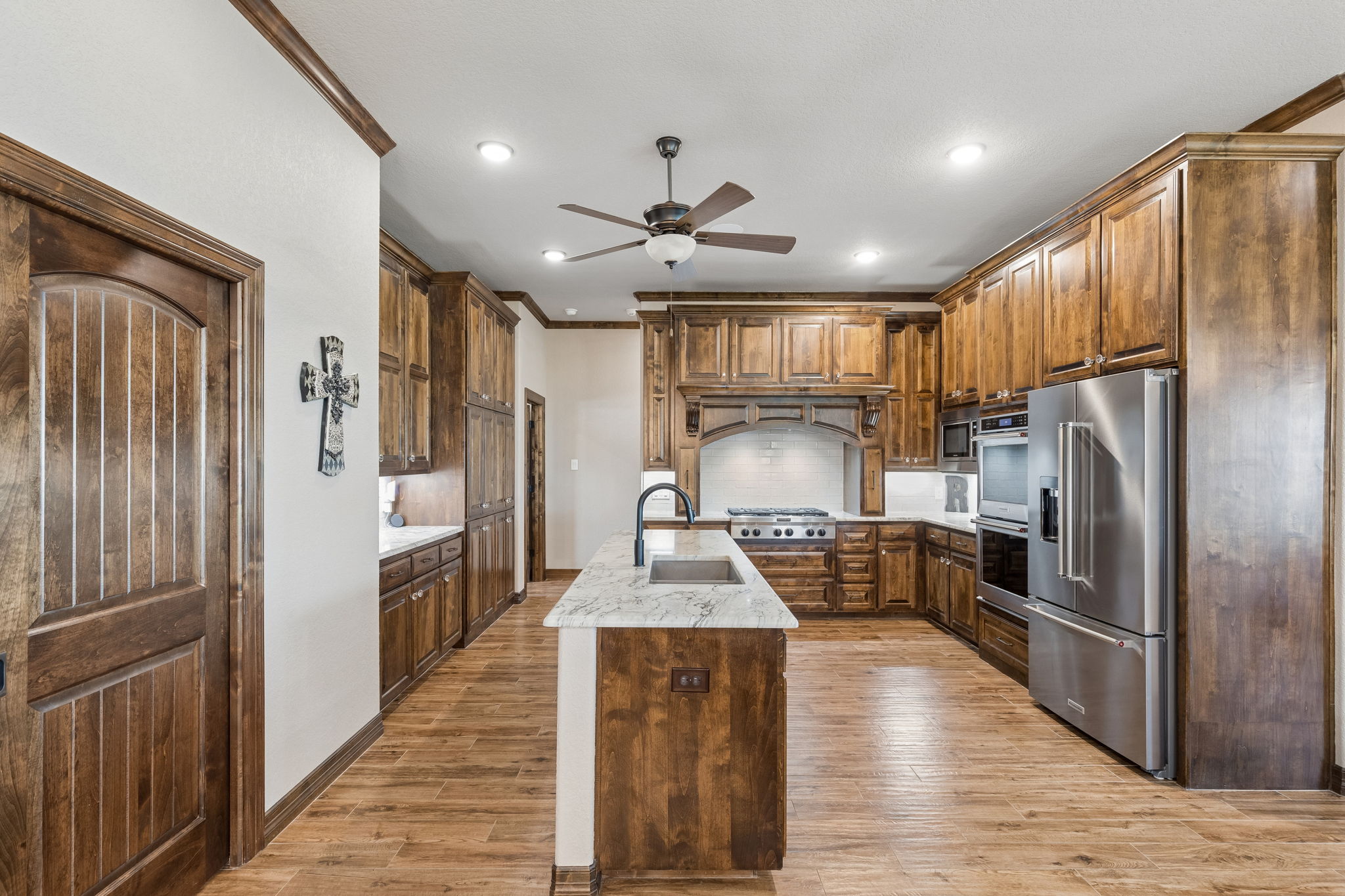 The door on the left open up to a huge walk-in kitchen pantry.