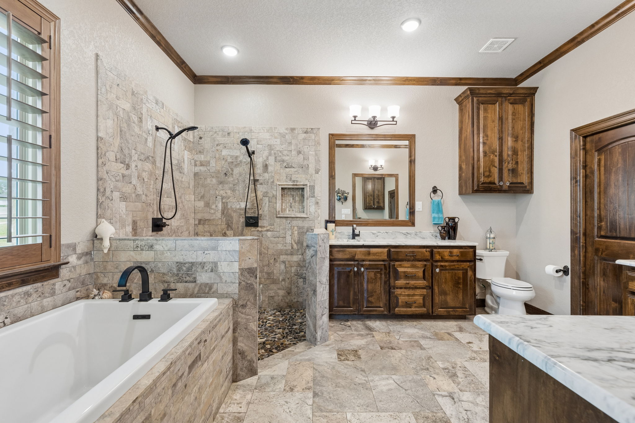 Door on the right leads to the primary suite walk-in closet and laundry room.