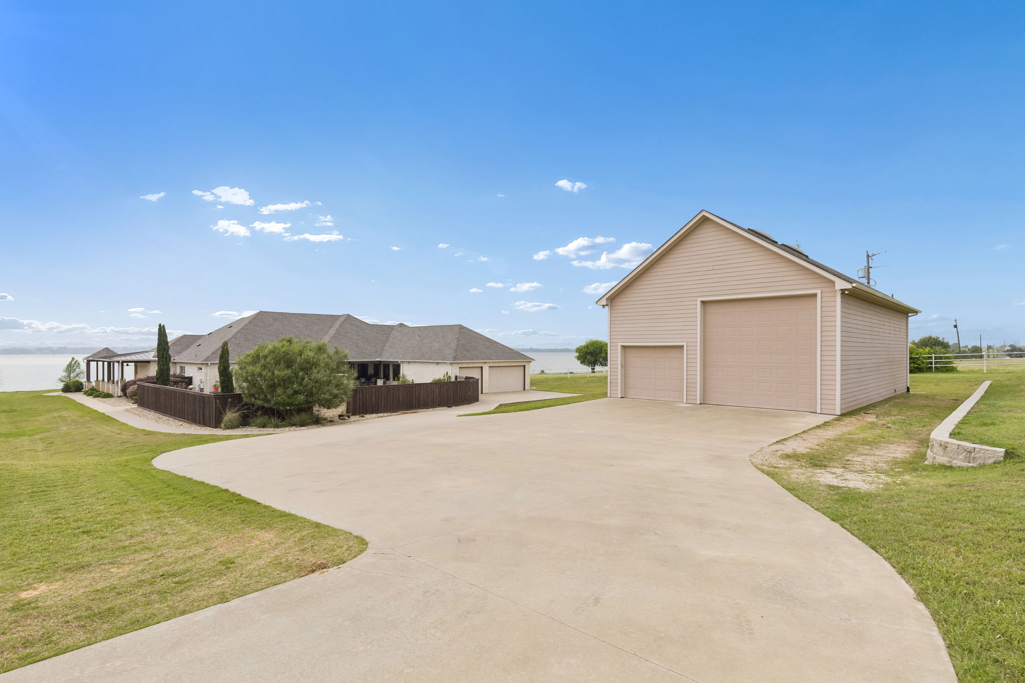 The RV barn has two garage doors, one is 14' and the other is 10'. The home has three parking spaces.