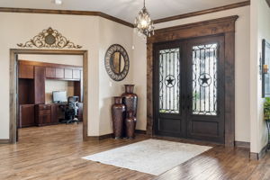 Magnificent double iron doors in the foyer and fresh doors (folded back) lead not the office.