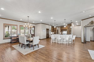 The lovely chandelier lends elegance and shimmer to the dining space.