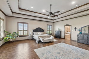 Beautiful views of a meadow flank the bed in this photo.