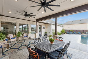 Dining or relaxing space in the shade and a door leading to a half bath for your guest's convenience.