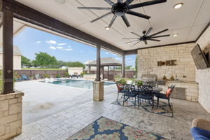 Outdoor kitchen, television, ceiling fans and surround sound to create a comfortable mood for your enjoyment.