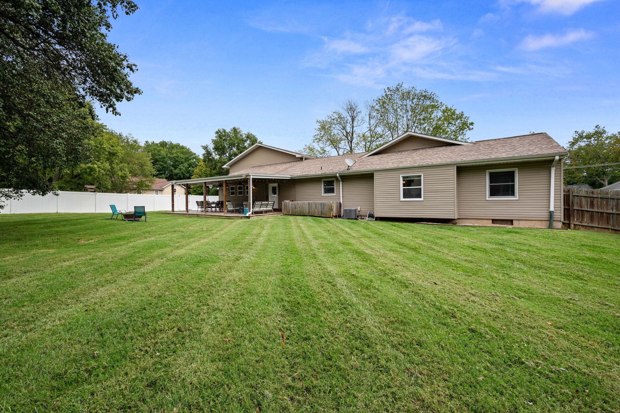 The backyard, the backyard. Green, private, and a TON of flat and fully-fenced area of POTENTIAL. Dream it and built it. Pool, playground, garden, firepit, hot tub. Room for ALL of it.