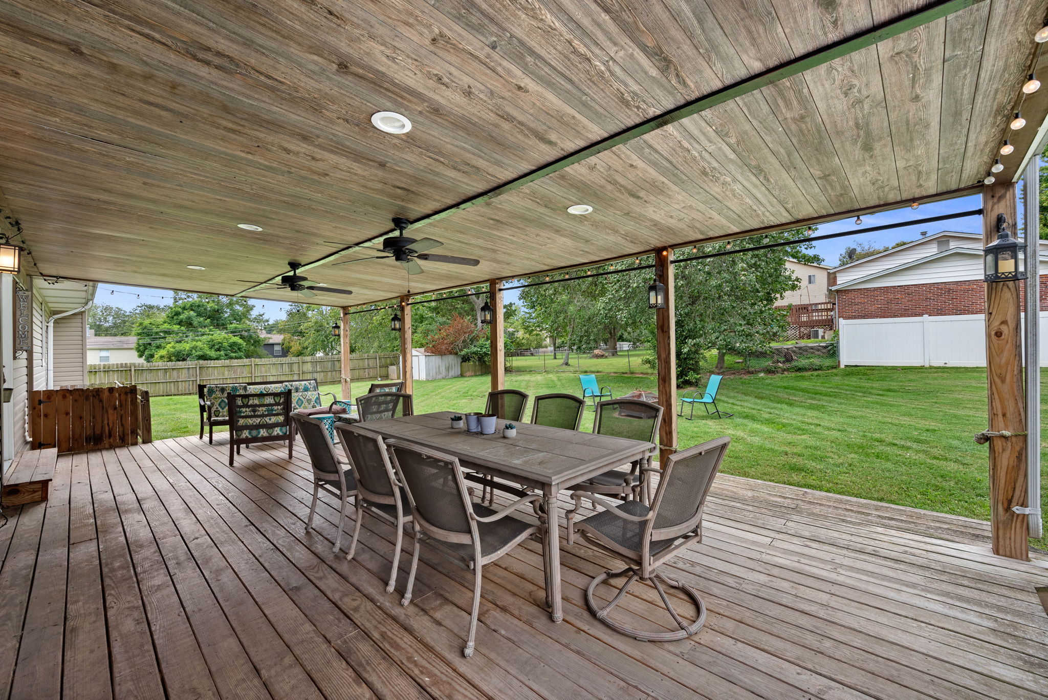 The covered back porch is already perfection with recessed lighting, ceiling fans, and twinkle lights. Bring yourself and the wine!