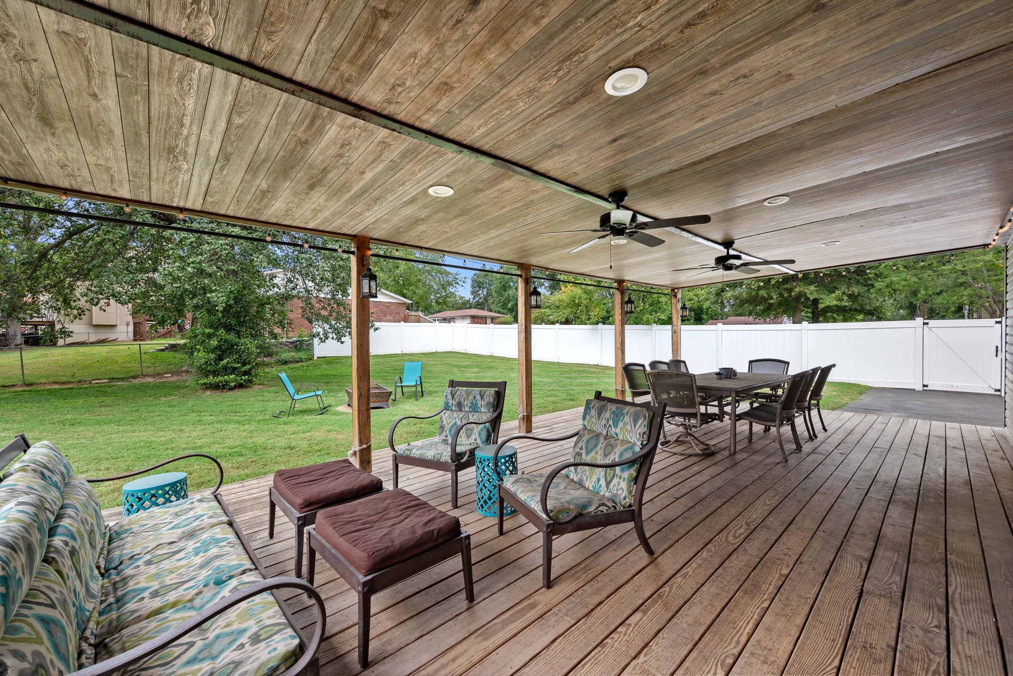 View 2. There is also a sizable paved area in the backyard for extra parking, an outdoor kitchen, grilling, or shooting hoops like the current owners. The vinyl fence has a double gate for access.