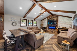 Can't you picture family evenings cozied up in this room? Bonus: the no-maintenance fireplace is remote controlled and has numerous light/heat settings.