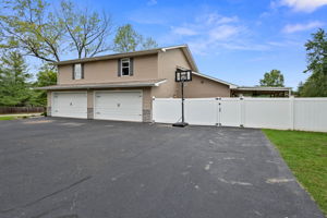 Yes, a 4 car garage and an ENORMOUS driveway.