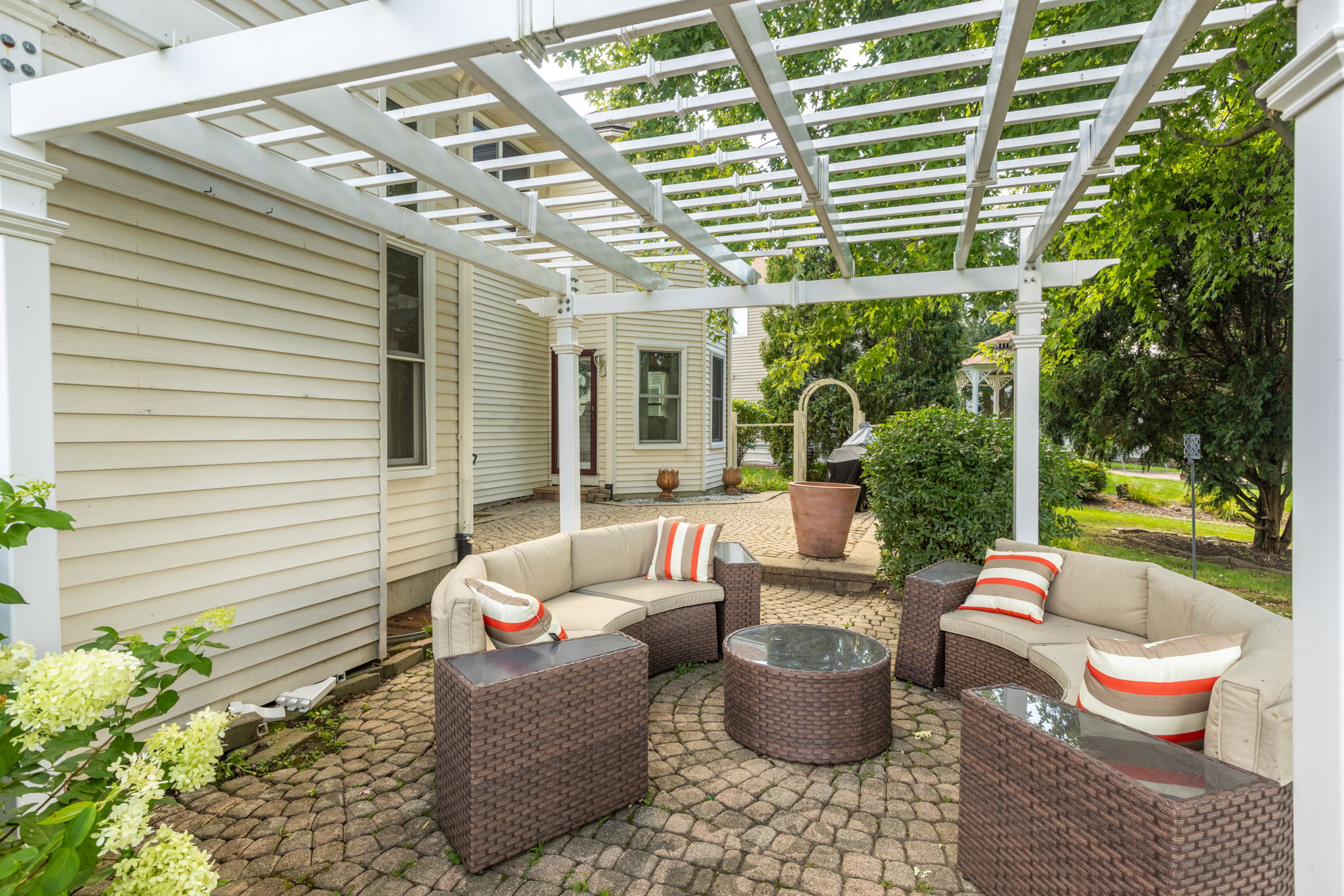 Brick Paver Patio with Pergala
